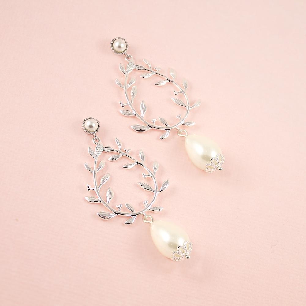 Silver Cassia Pearl Drop Bridal Earrings on pink