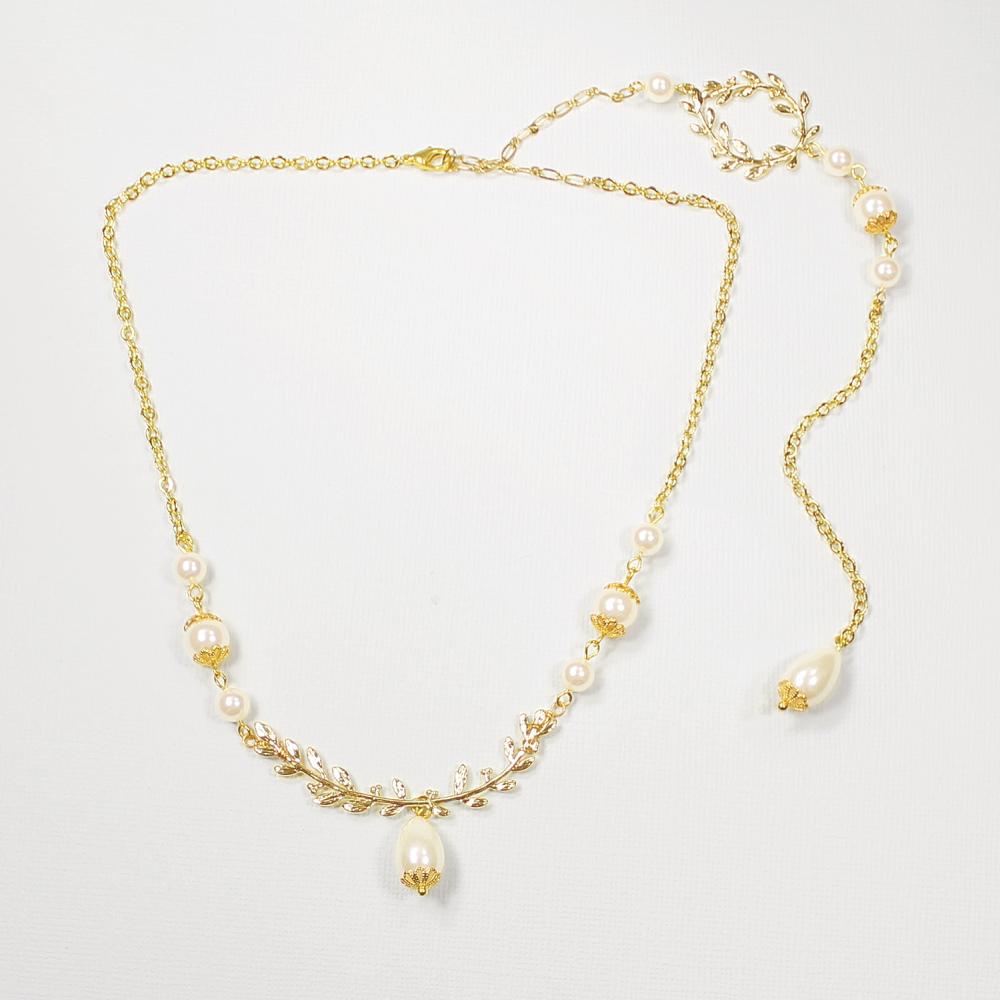 Gold Cassia Leaf Backdrop Bridal Necklace on grey