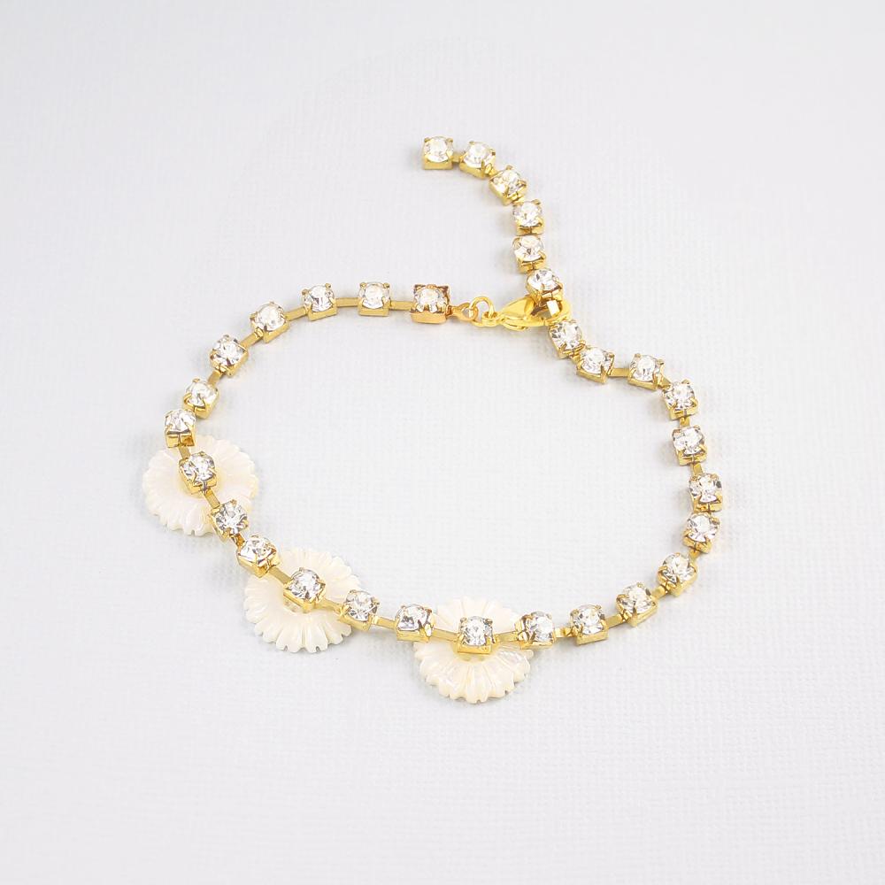 Gold Chloe Pearl & Crystal Daisy Bracelet on grey