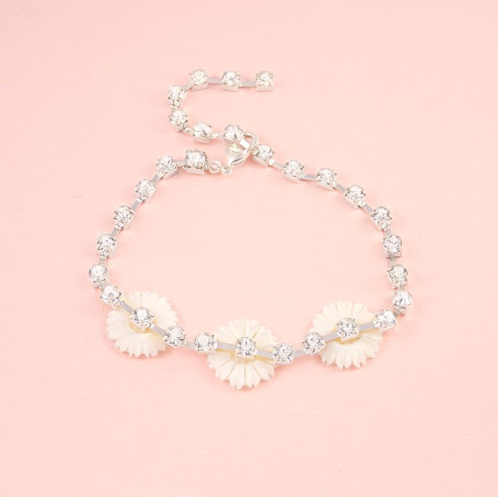 Silver Chloe Pearl & Crystal Daisy Bracelet on pink