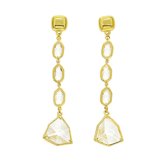 Faven modern gold and crystal dangle earrings on white background