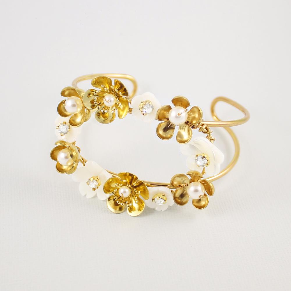 Gold Felicity Floral Cuff Bracelet on grey