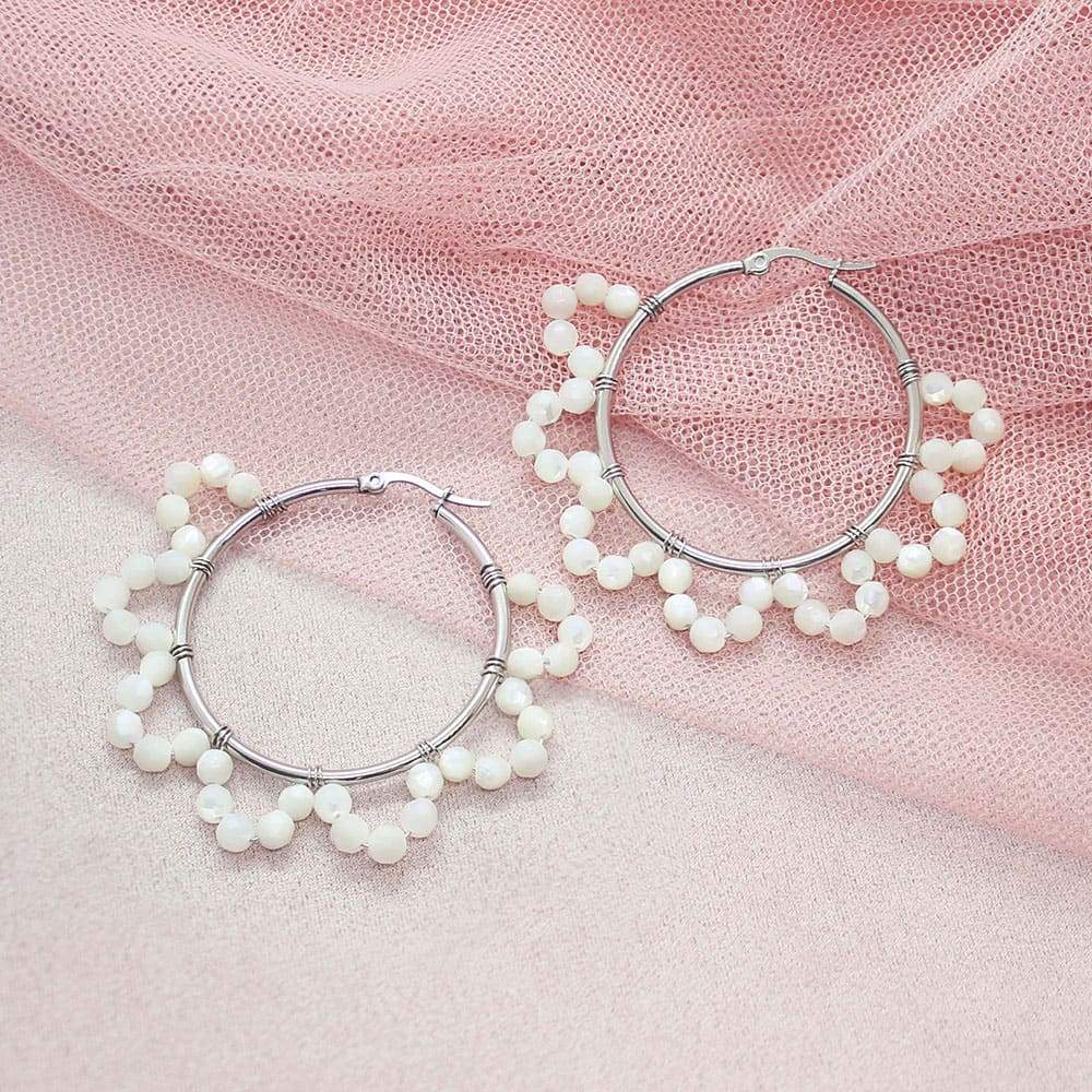 Jesy Pearl Hoop Earrings on pink