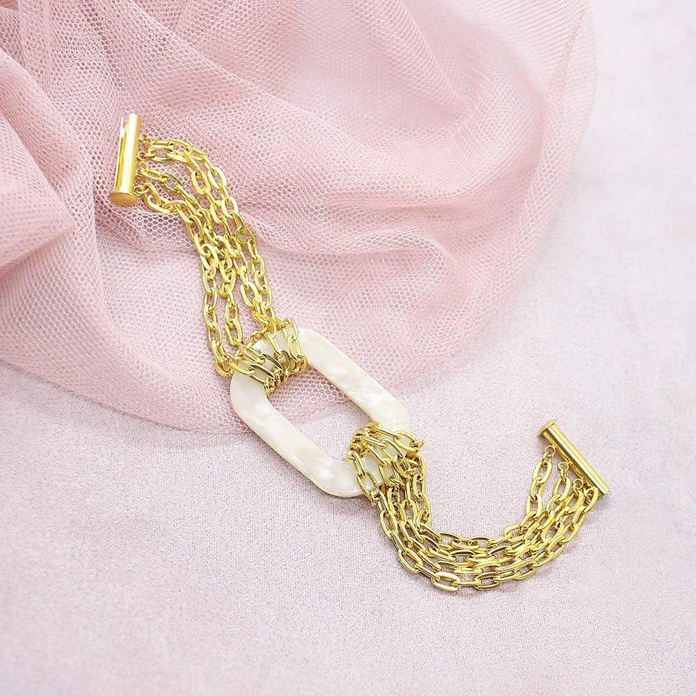 Ivory Joss Gold Chain Bracelet on pink