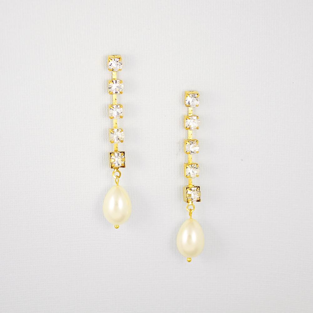 Gold Juno Bohemian Pearl Drop Earrings on grey