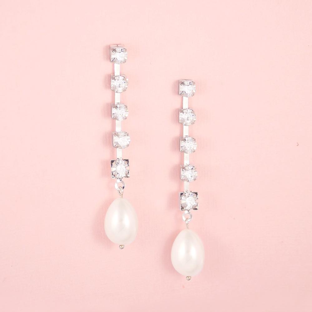 Silver Juno Bohemian Pearl Drop Earrings on pink