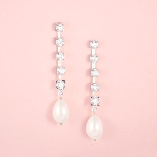 Silver Juno Bohemian Pearl Drop Earrings on pink