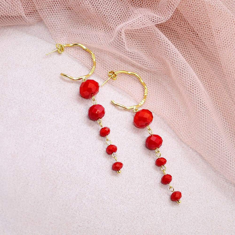 Red Kelana Dangle Bead Earrings on pink