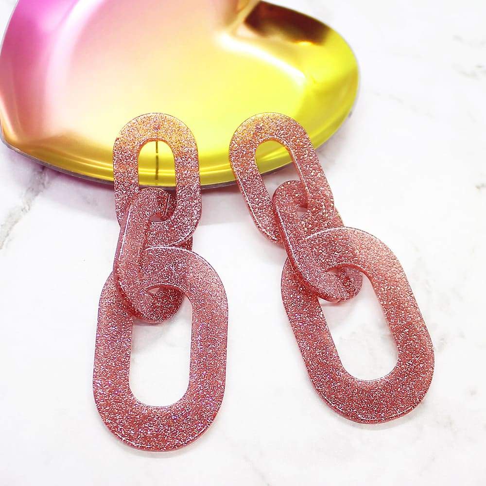 Locked Out of Heaven Glitter Earrings pink