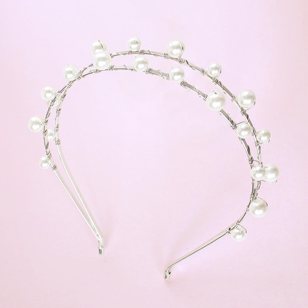 Silver Lulu Double Pearl Bridal Headband on pink
