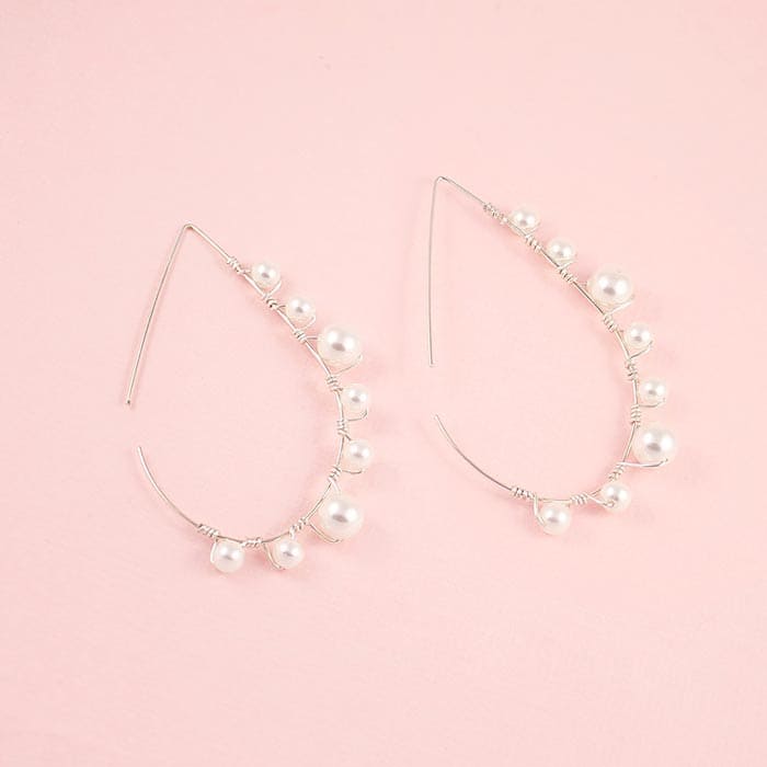 Lulu pearl teardrop hoop earrings silver with off white pearls on pink background