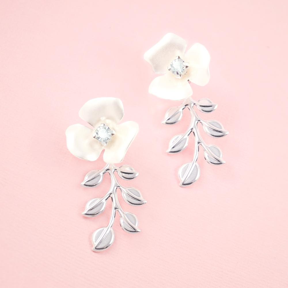 Silver Lyra Flower Bridal Earrings on pink