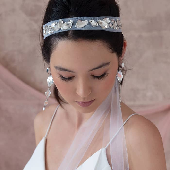 Modern bridal Sza headband veil in off white colour. Front closeup of crystals
