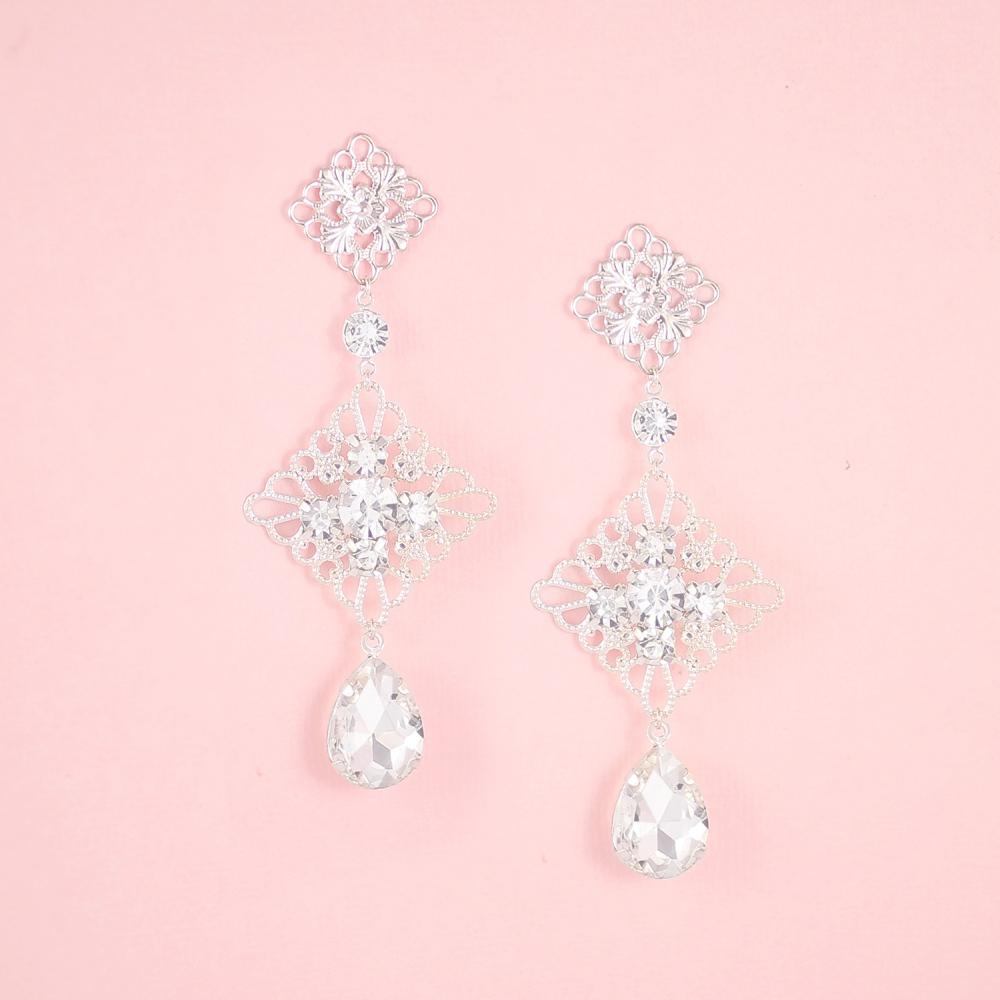 Silver Nicola Boho Chandelier Bridal Earrings on pink