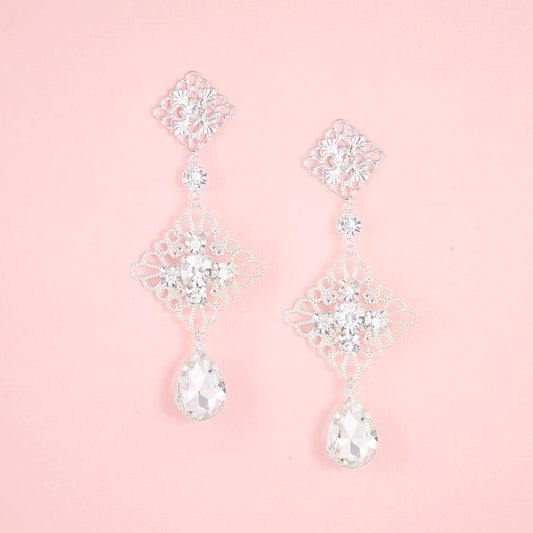 Silver Nicola Boho Chandelier Bridal Earrings on pink