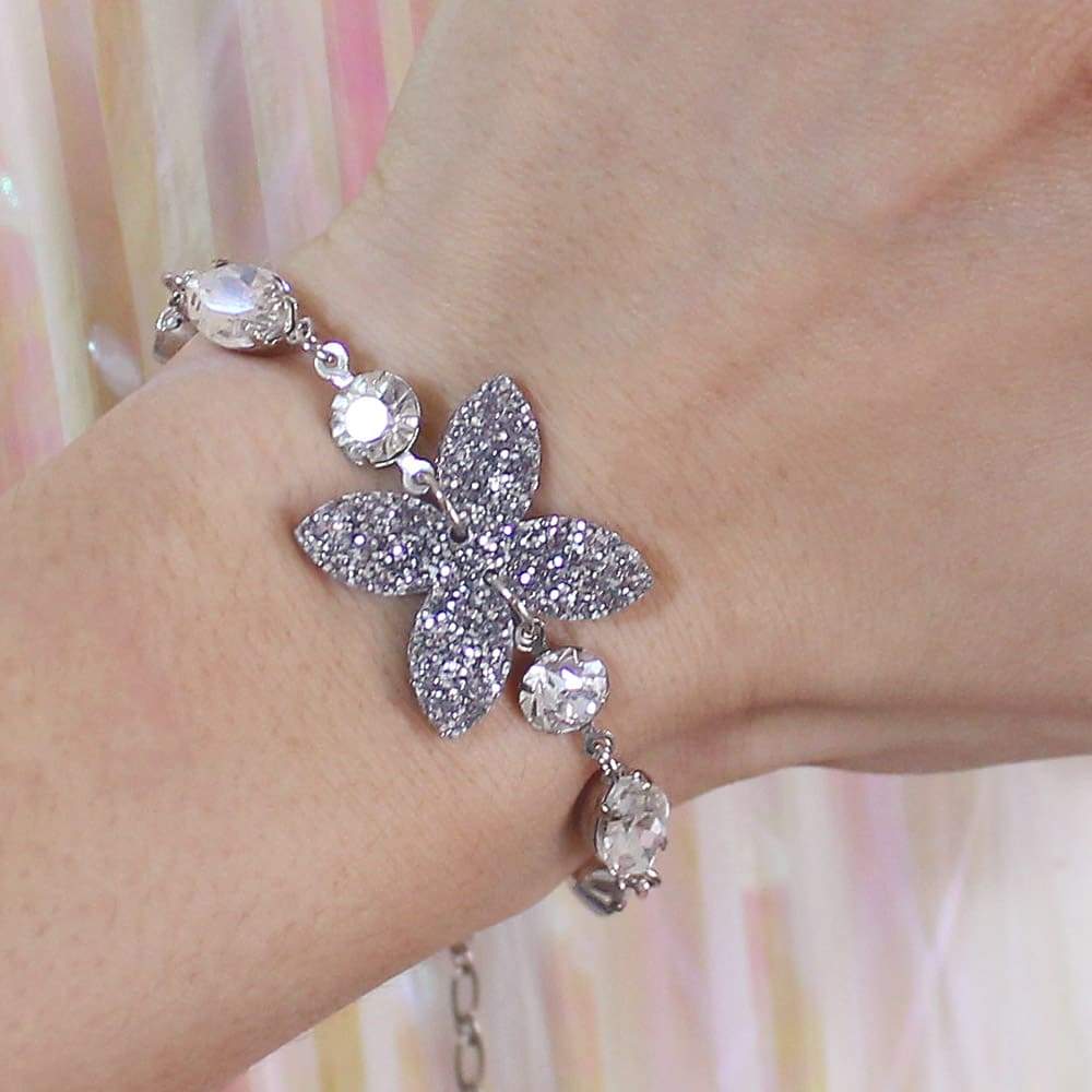 Ophelia Glitter Charm Bracelet on left wrist