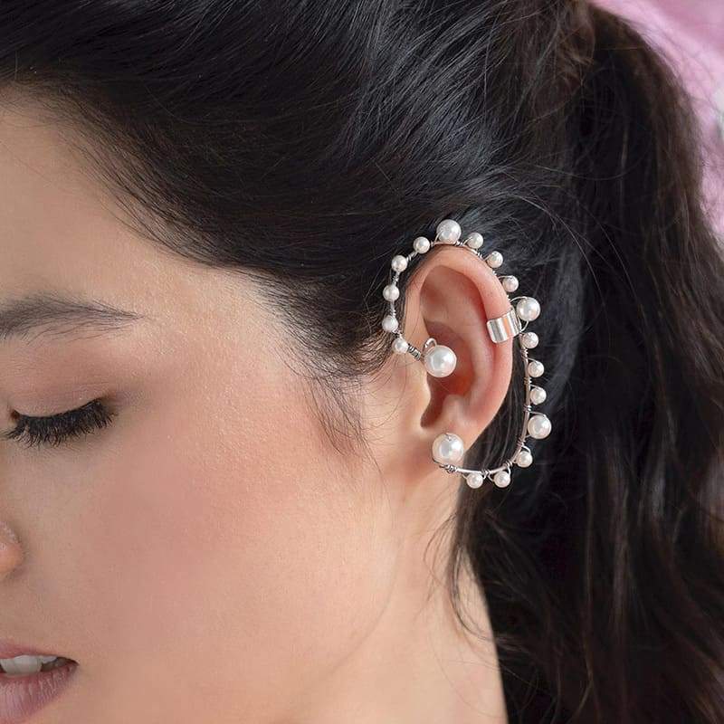 Off-white Ora Pearl Ear Climber on left ear