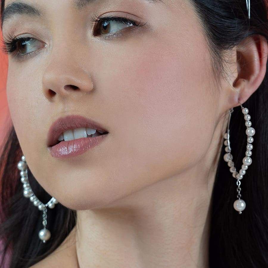 Left & right Off-white Ora Pearl Hoop Earrings from front
