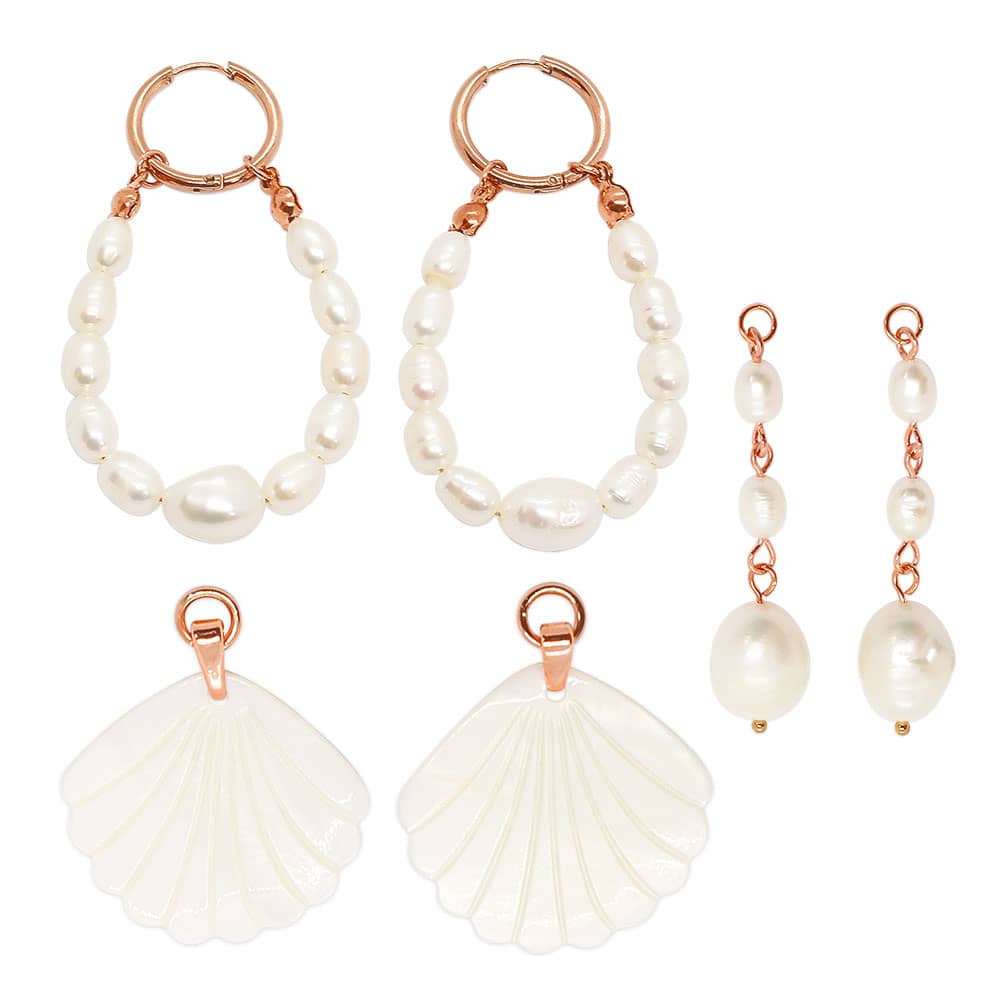 Rue rose gold pearl earrings set flat lay white background.