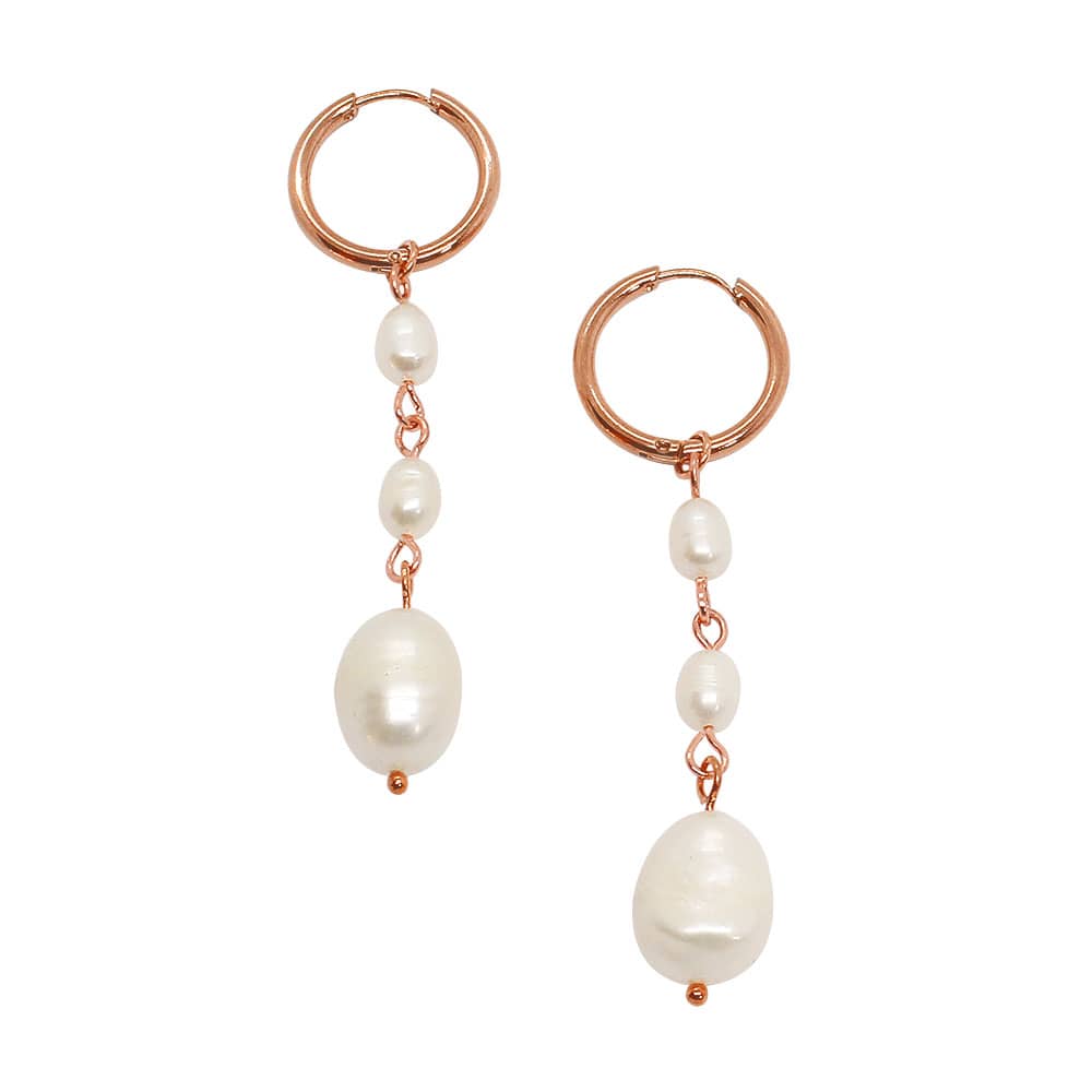 Rue rose gold pearl earrings set with three pearl drops on white background