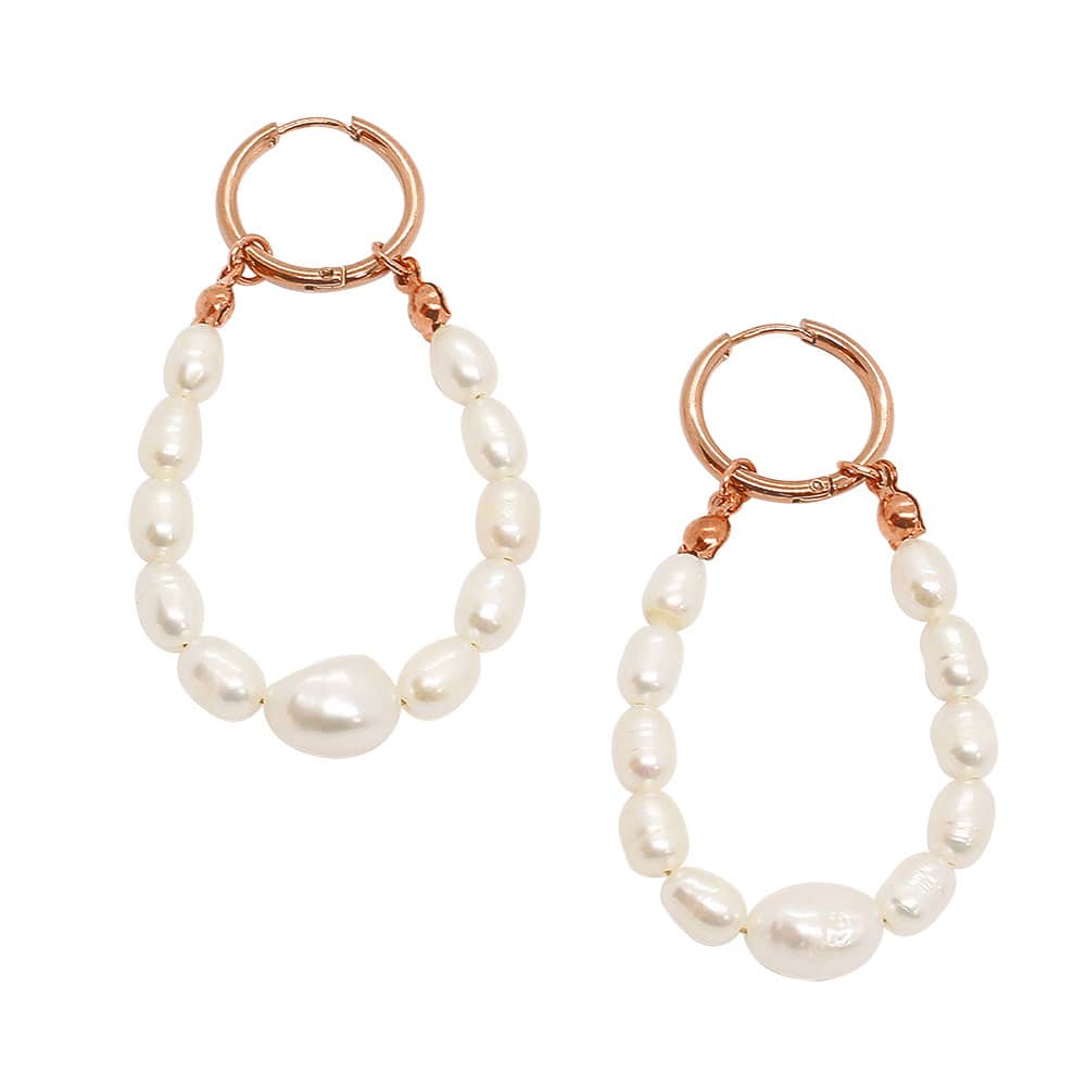 Rue rose gold and pearl earrings with freshwater pearl loops on white background.