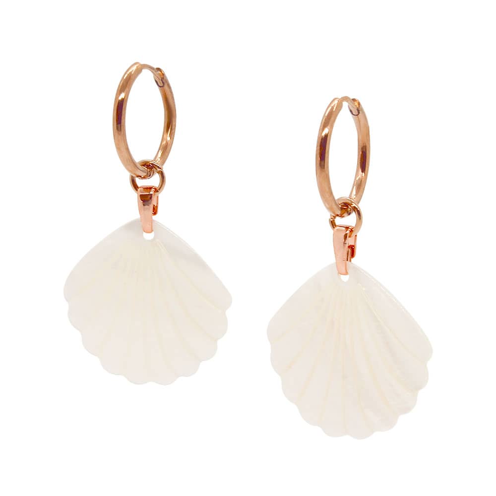 Rue rose gold pearl earrings set with shell charms on white background