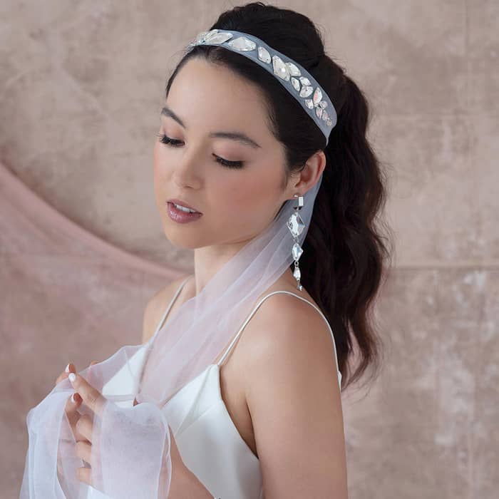 Sza bridal headband veil in off white colour, side view with tulle ribbons flowing down the front