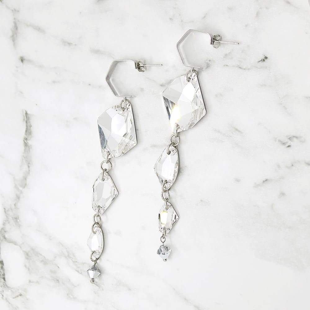 Sza Modern Glam Crystal Earrings on grey