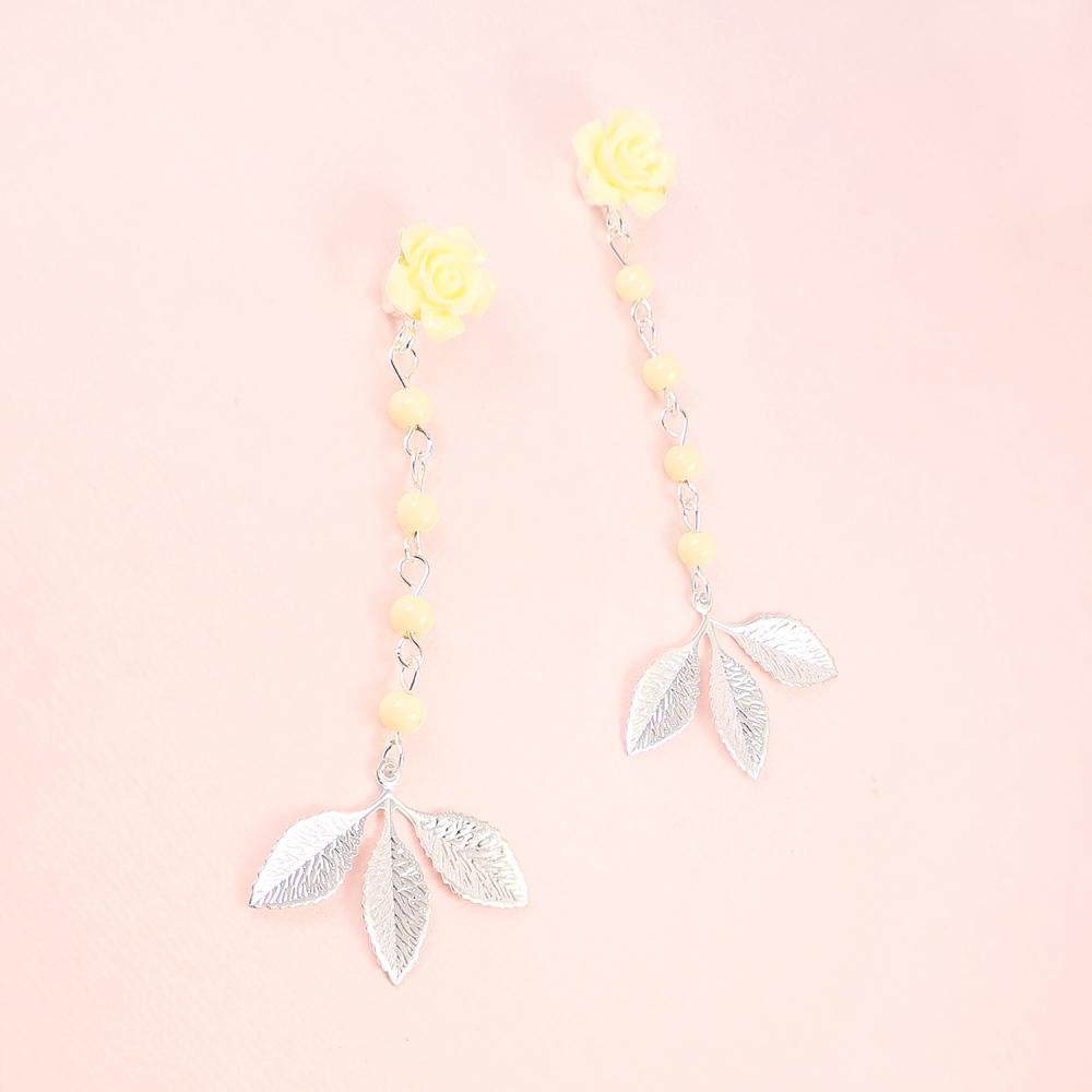 Silver Thea Leaf Earrings on pink
