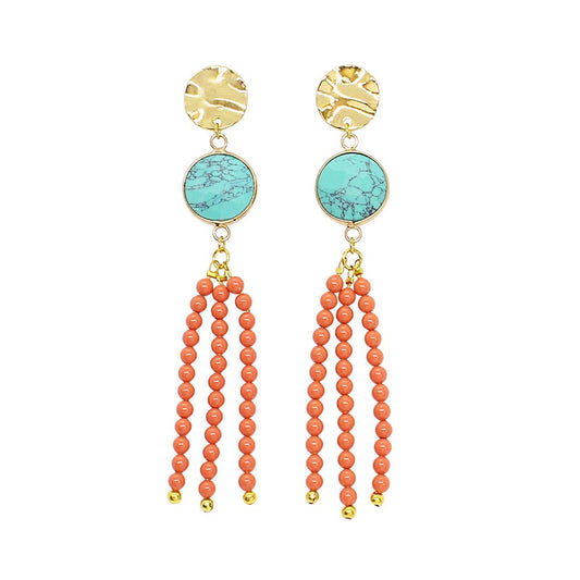 Tinashe turquoise and coral tassel earrings on white background
