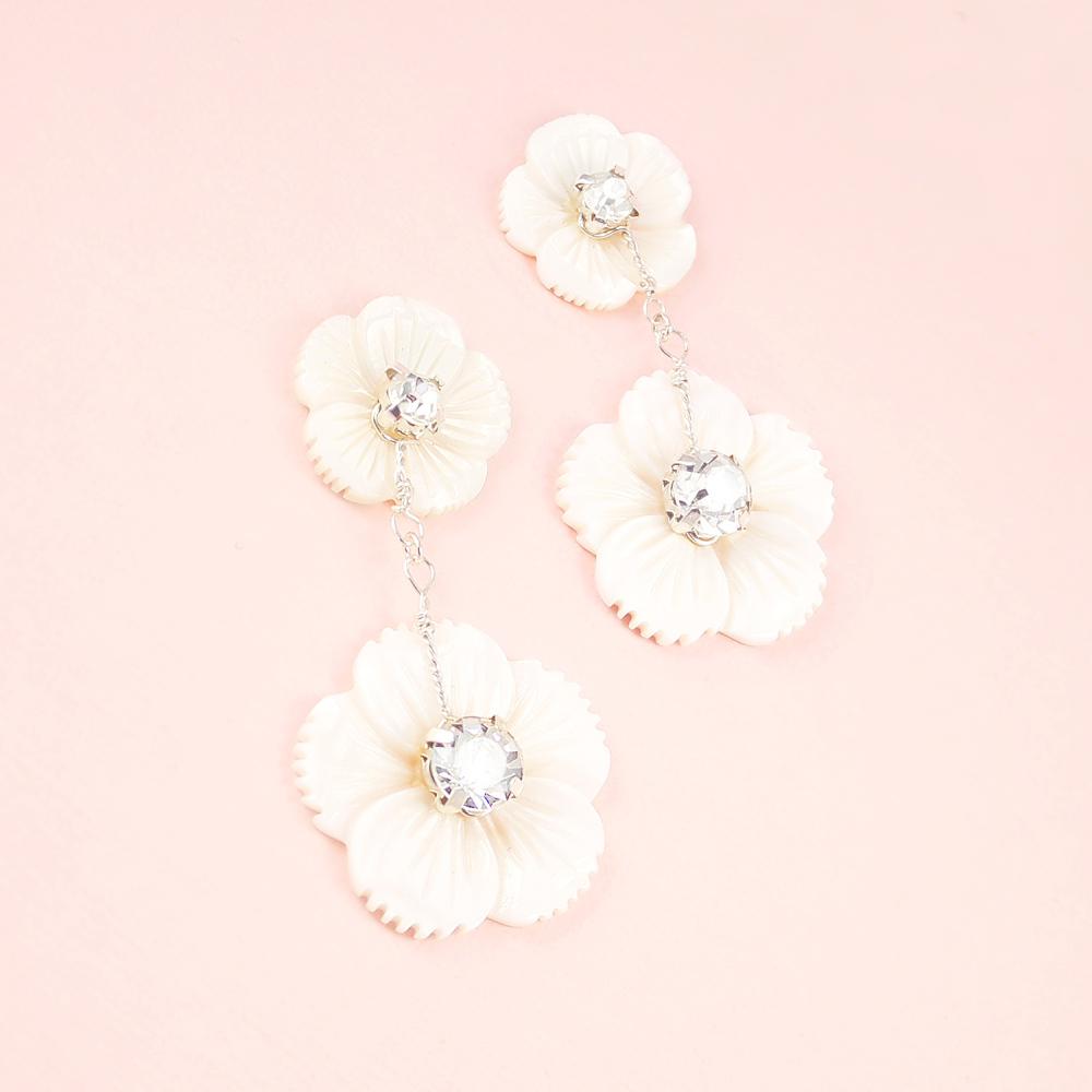 Silver Wanika Tropical Flower Bridal Earrings on pink